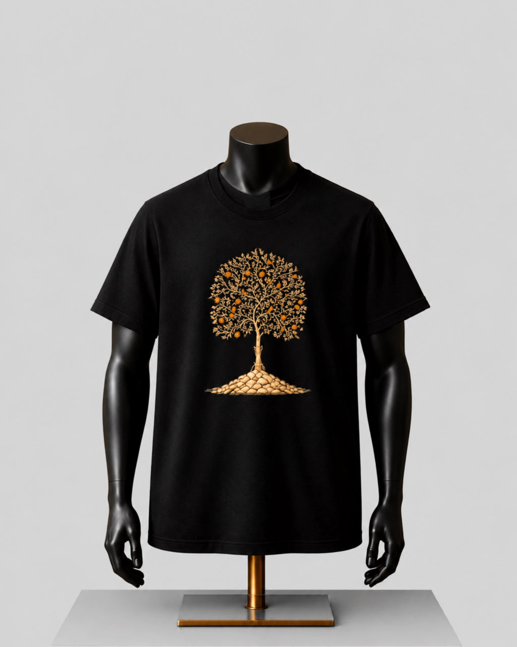 A black short-sleeve t-shirt displayed on a black mannequin torso with a metallic gold tree graphic on the chest, set against a neutral gray background.