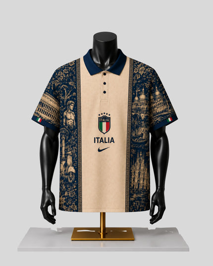 A short-sleeve polo shirt displayed on a black mannequin torso with a gold stand against a light gray background. The shirt has a beige center panel with the Italian crest and the word 'ITALIA' above a Nike swoosh, flanked by dark navy blue panels featuring architectural and historical illustrations.