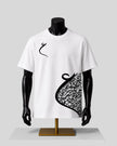 White short-sleeve t-shirt displayed on a black mannequin torso with a gold stand, featuring a black abstract graphic print on the front, set against a light gray background.