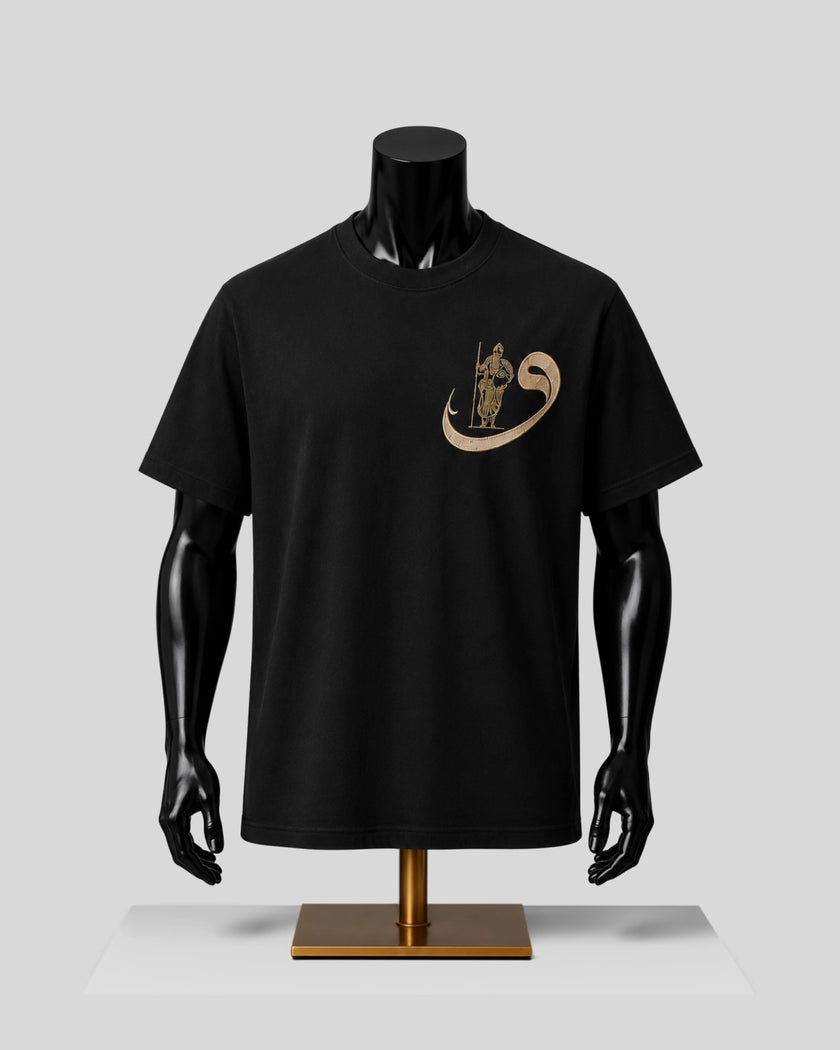 A black short-sleeve crewneck t-shirt displayed on a black mannequin torso with a gold graphic on the left chest, set against a light gray background.