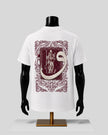 White short-sleeve T-shirt displayed on a black mannequin torso, showing the back with a large ornate burgundy graphic print featuring a snake and a figure in a decorative frame.