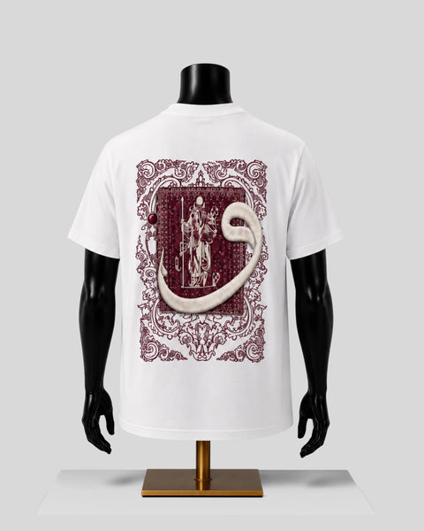 White short-sleeve T-shirt displayed on a black mannequin torso, showing the back with a large ornate burgundy graphic print featuring a snake and a figure in a decorative frame.
