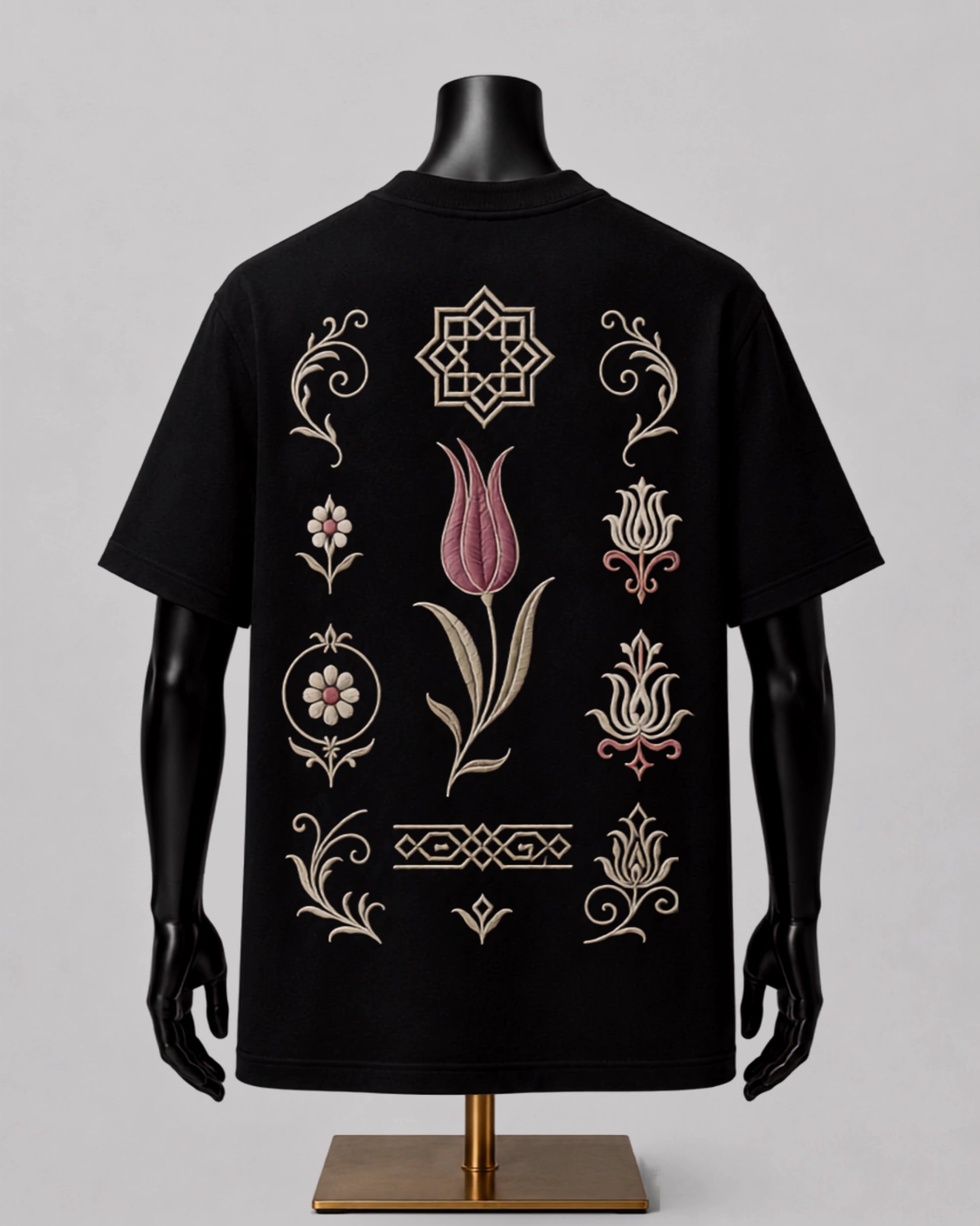 Black premium cotton T-shirt featuring a crimson tulip-inspired heritage back graphic.