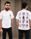 A man modeling a white short-sleeve t-shirt with a small tulip graphic on the front and a large set of traditional floral and geometric patterns on the back, shown in front and back views against a neutral brown background.
