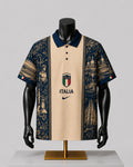 A short-sleeve polo shirt displayed on a black mannequin torso and stand against a light gray studio background. The shirt has a cream center panel with 'ITALIA' and a Nike swoosh, flanked by dark navy blue and beige scenic architectural tapestries.