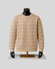 A beige crewneck sweater with a repeating brown interlocking 'R' monogram pattern, displayed on a black mannequin with black gloves and a gold stand against a light gray background.