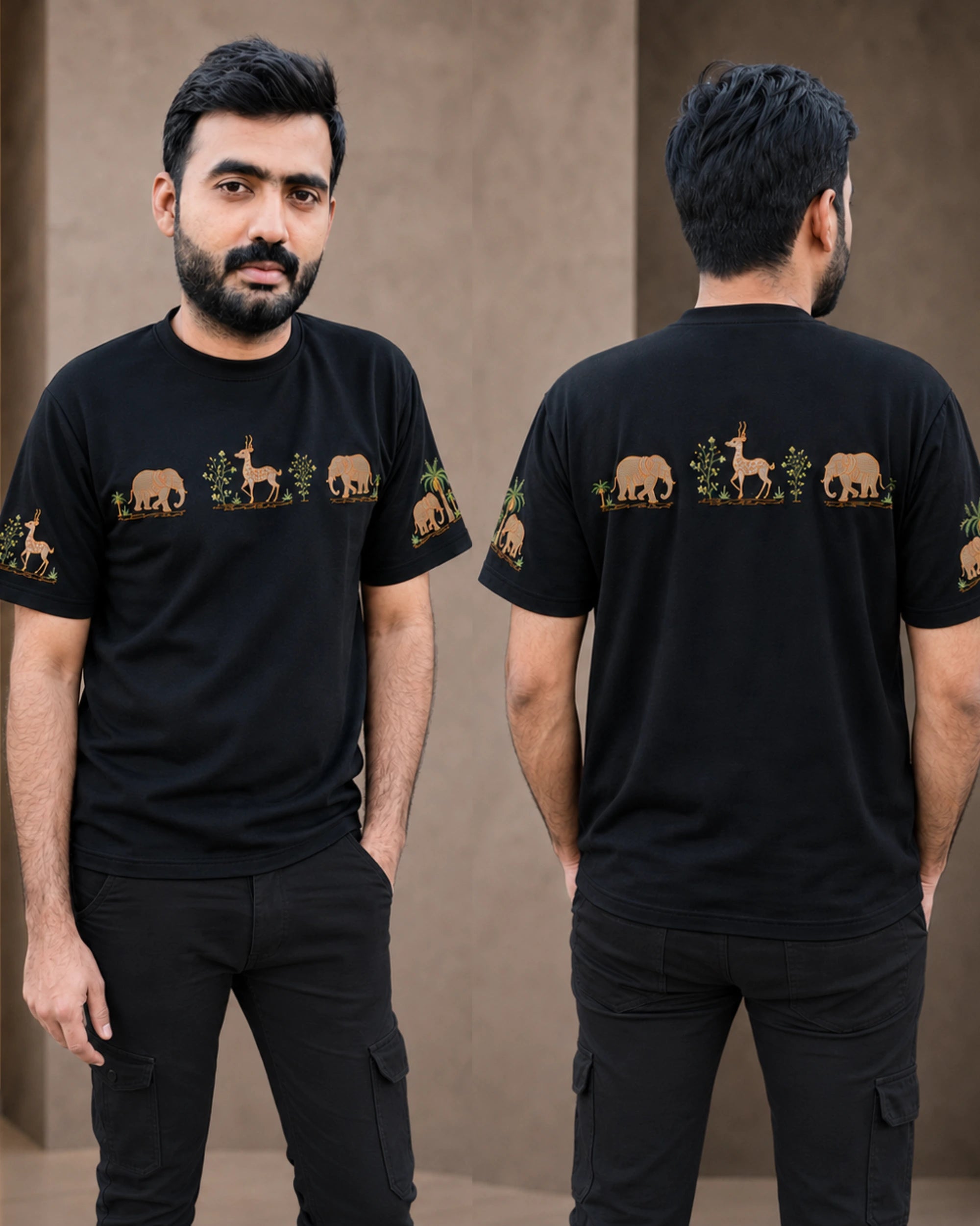 A man modeling a black short-sleeve t-shirt with a horizontal graphic print of safari animals (elephants, giraffes, zebras) and plants in tan and green, shown from both the front and back views against a neutral beige wall.