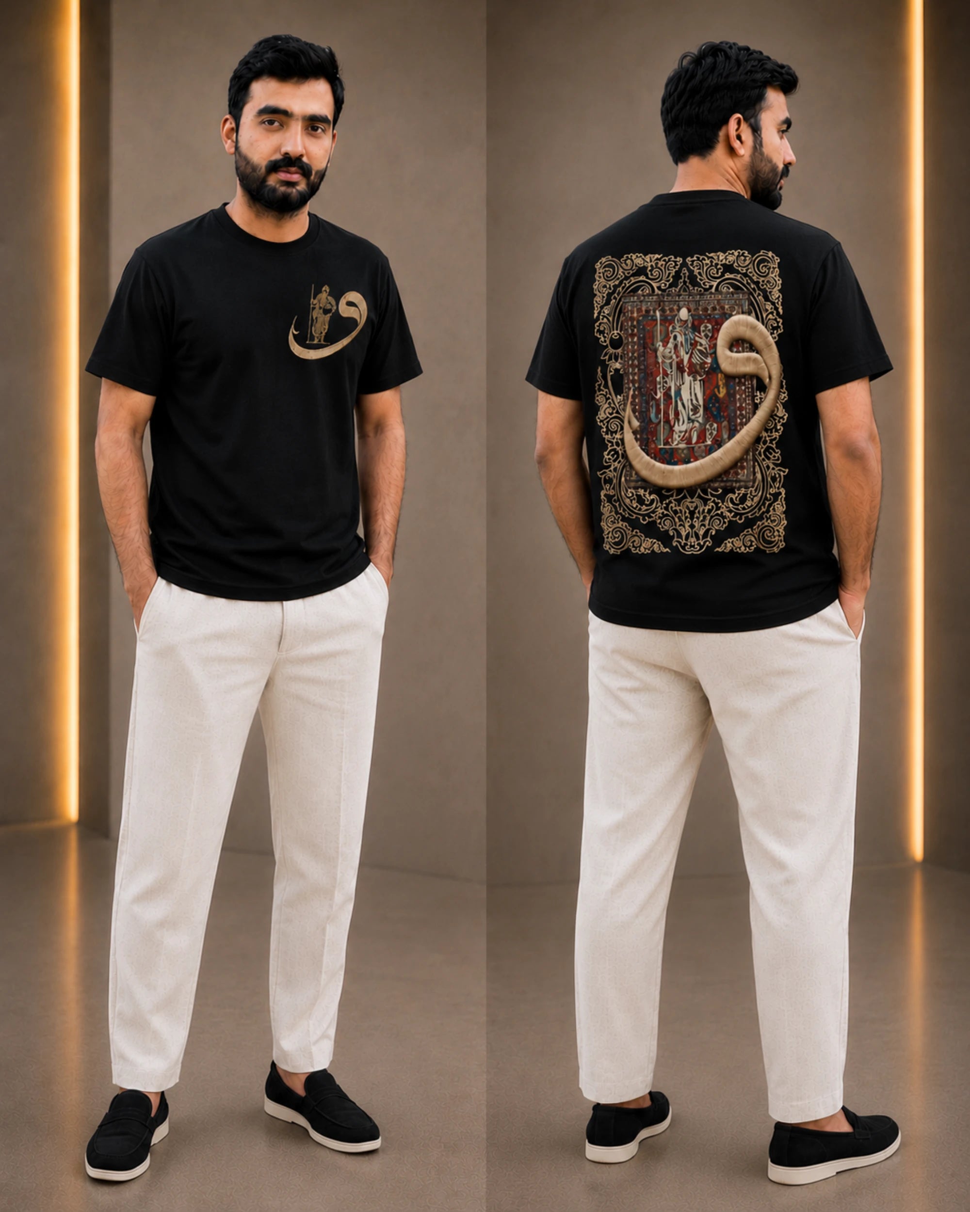 A man modeling a black short-sleeve graphic T-shirt shown from both front and back, paired with off-white trousers and black slip-on shoes in a studio setting with warm vertical light strips.